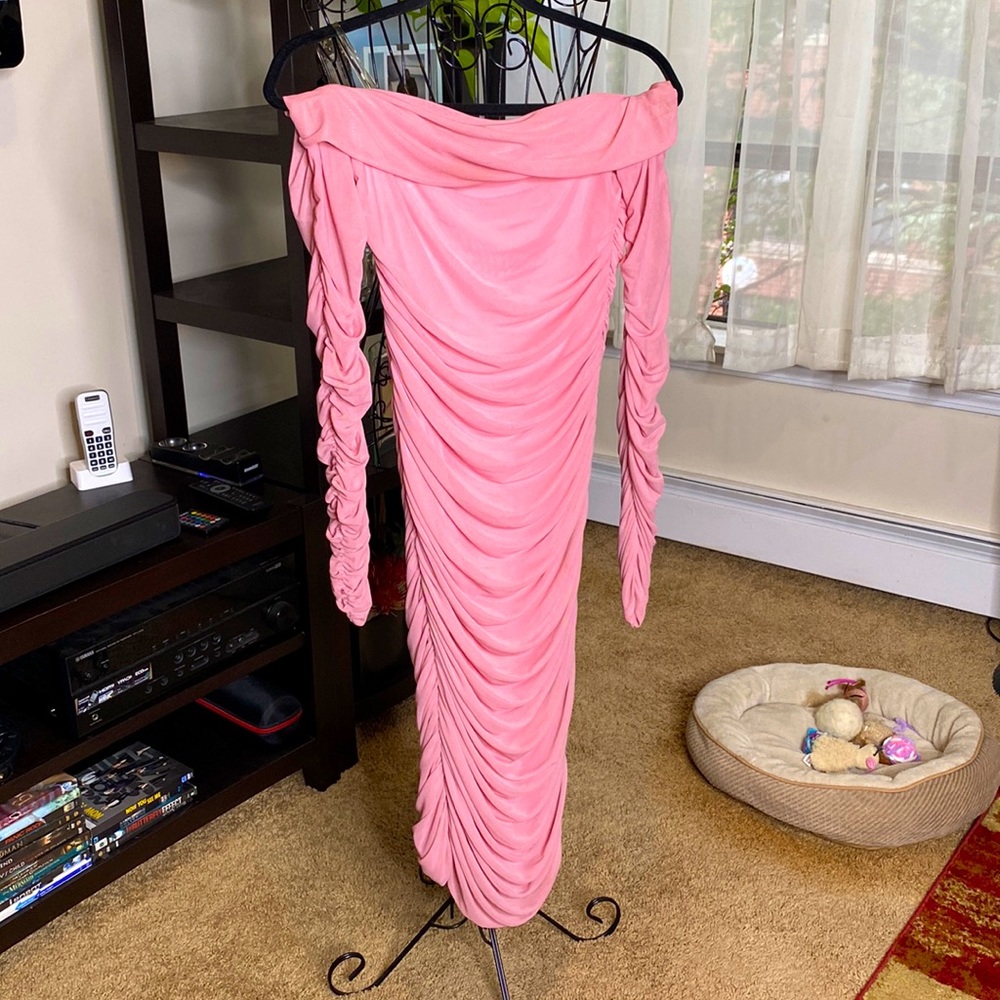 Off the shoulder chiffon pink dress with pleating.